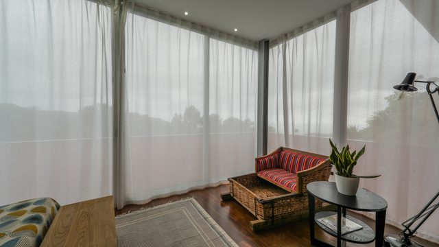 The toboggan seat by the window