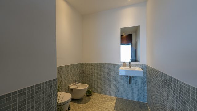 The grey mosaic bathroom