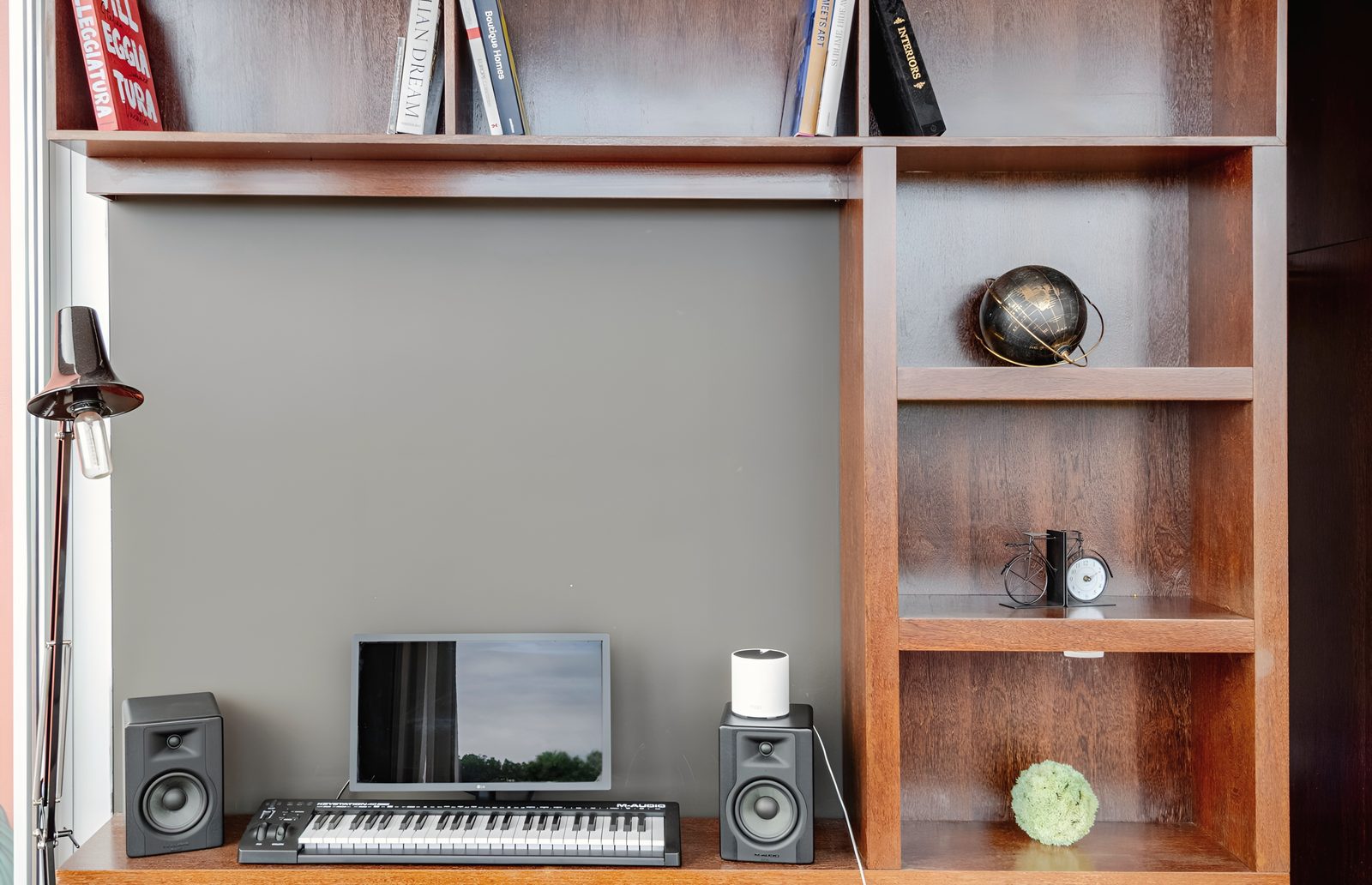 The music desk in the master suite: a keyboard, a screen and a pair of studio monitors