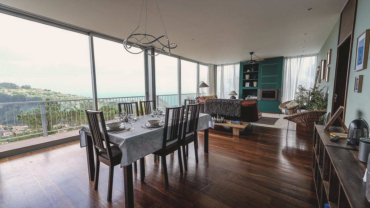 The dining table beside the glass wall